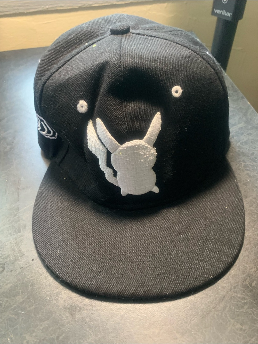 Black Snapback Hat with White Embroidered Character